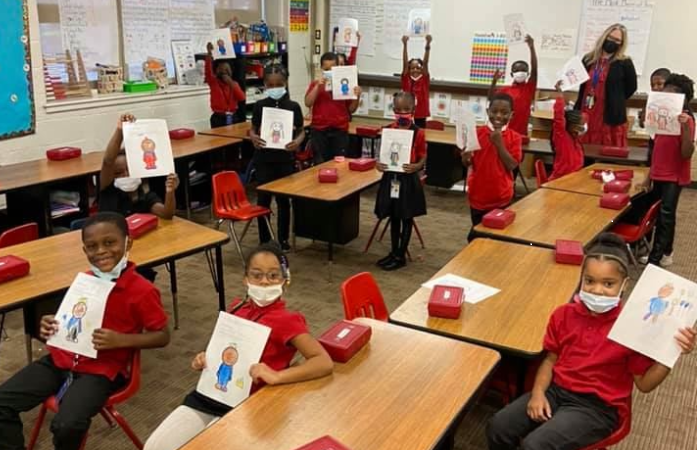  children and counselor in first grade classroom
